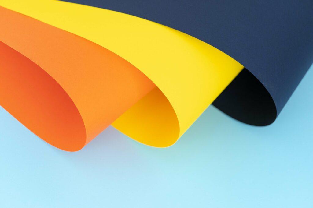 Orange yellow and blue papersheets