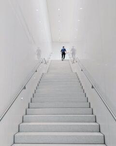 man walking up stairs