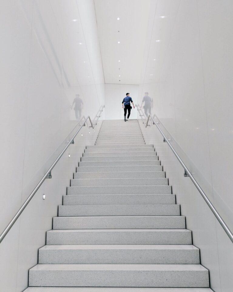 man walking up stairs