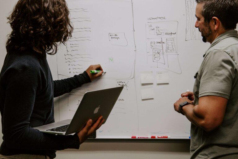 Two persons at a whiteboard