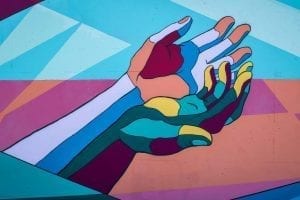colored hands holding each other