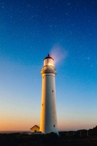 Lighthouse on a night sky