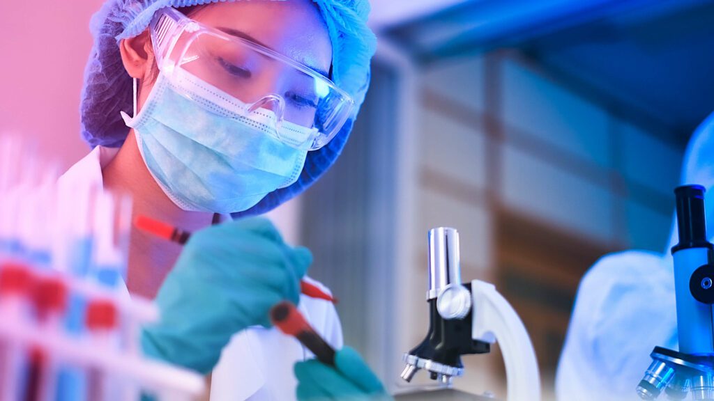 Woman in lab wearing face mask